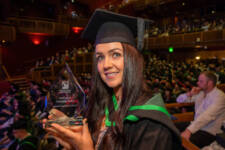 Holly Chemistry Teacher Graduate holds test tube with red liquid