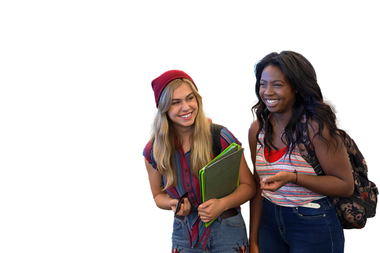 Two young female students walking and laughing together