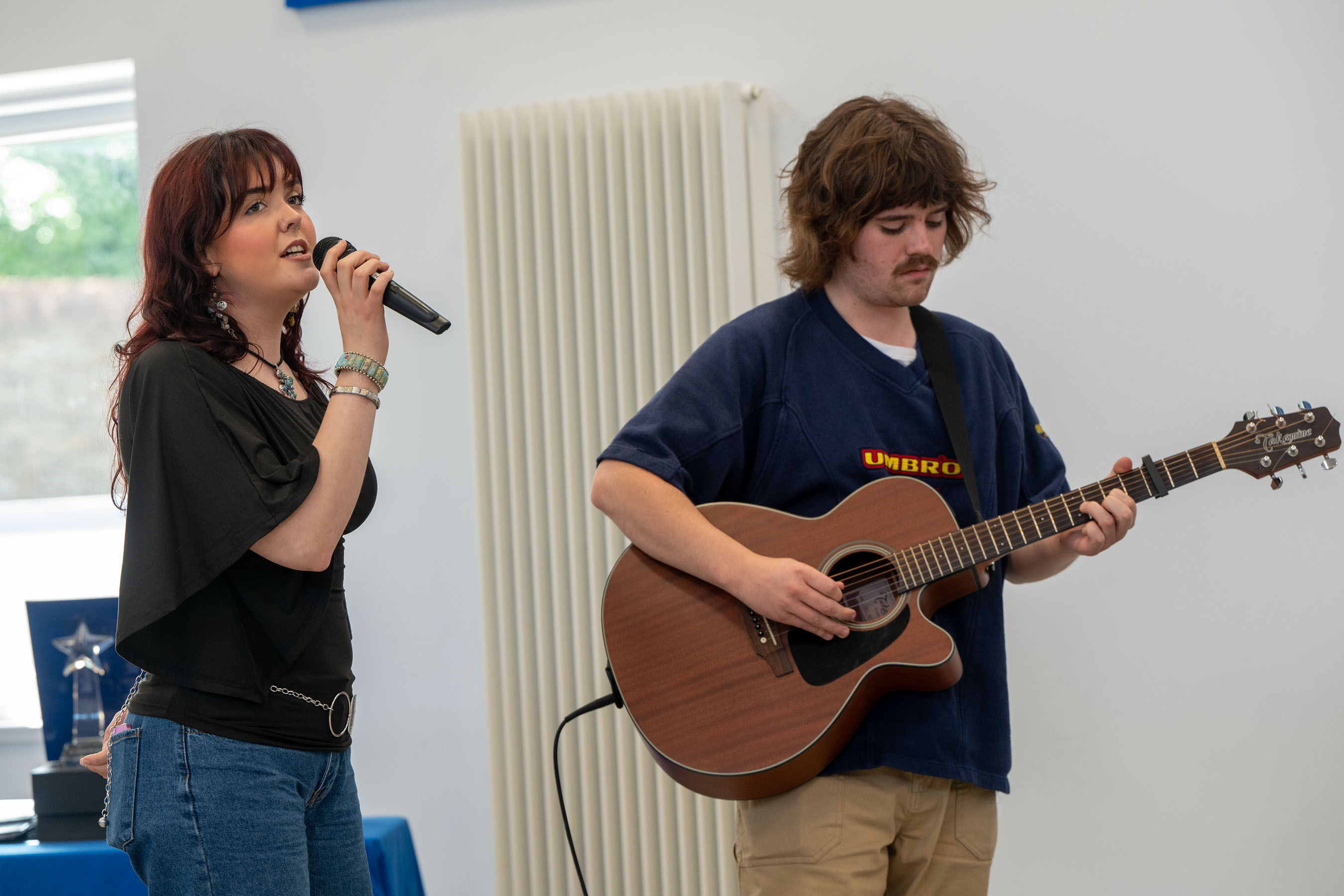 A singer and guitarist at celebration event