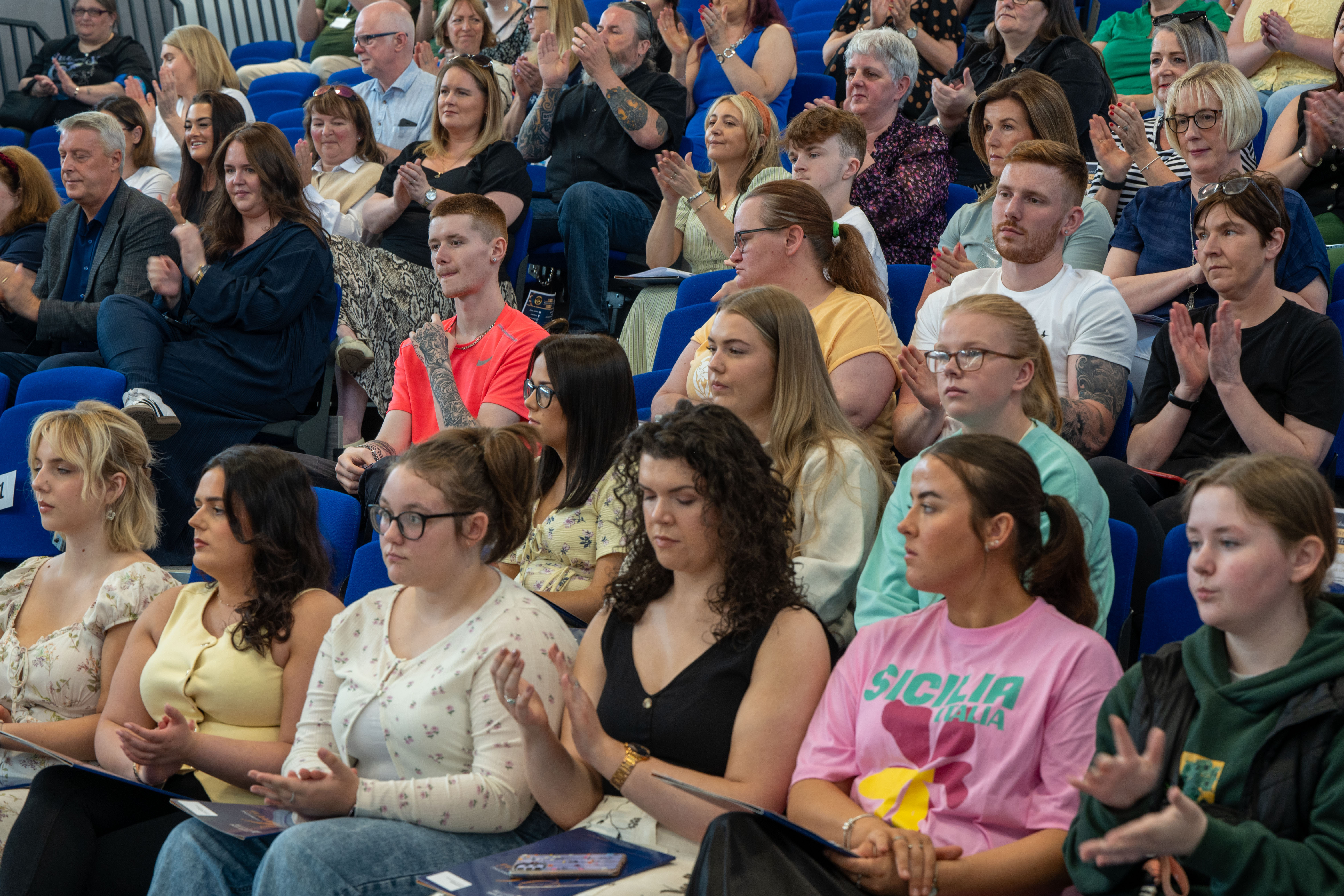 A section of the crowd at a college celebration event