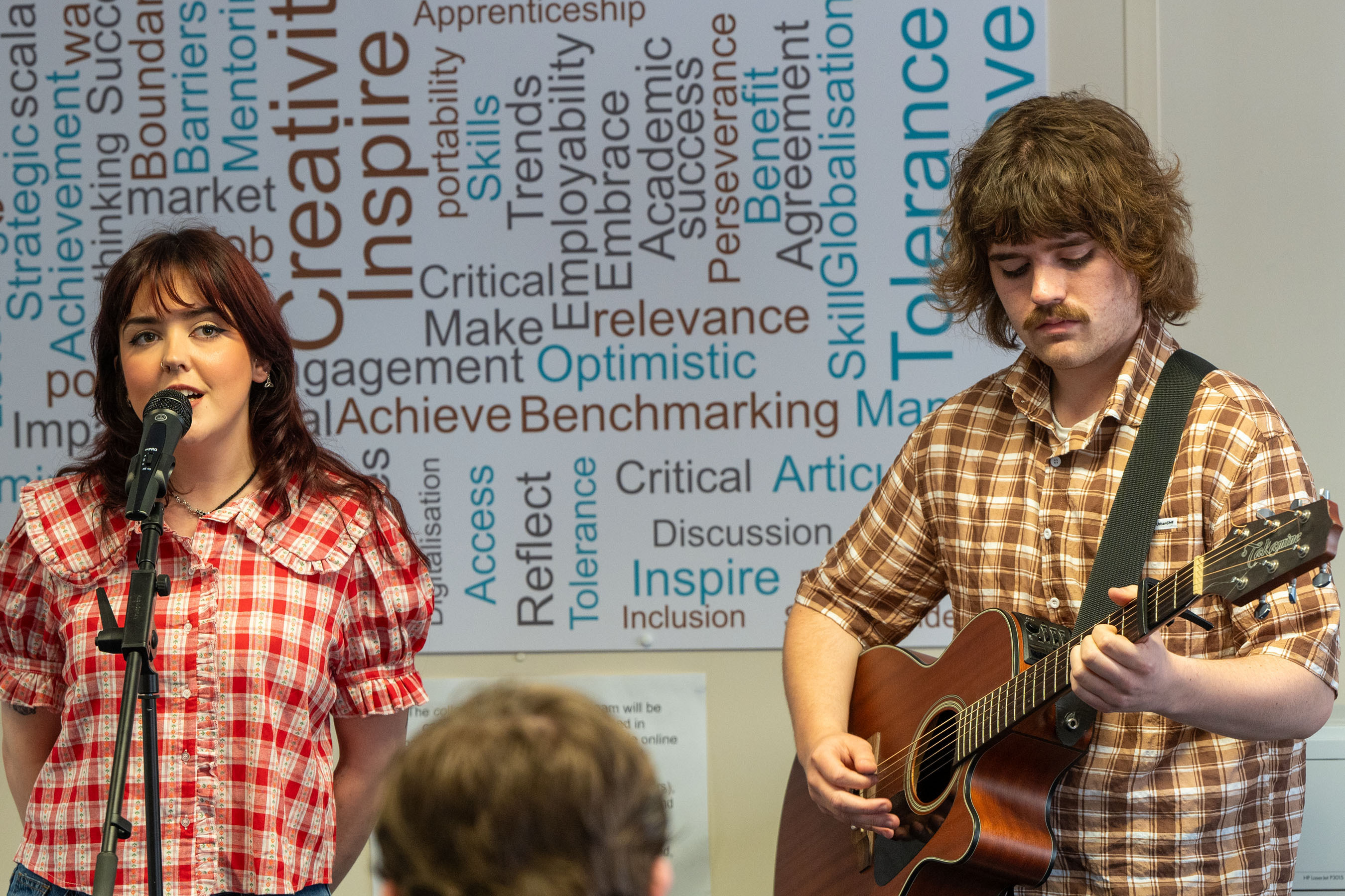 A singer ands guitarist at celebration event