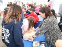 group of people in the marquee learning life saving skills