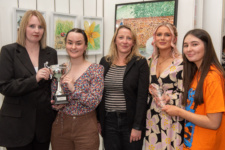 Five students pictured with their awards at the art exhibition