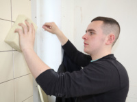 Kieron Gallagher competes in Wall and Floor Tiling.