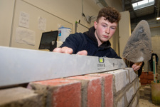 Caoimhim Doherty checks his work as he competes in Brickwork at NWRC's Skills competition.