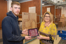 Dion Connor, first place prize winner in Plumbing, receives his award from Karen Moore, Head of Quality Enhancement at NWRC, during the college's Skills competition.