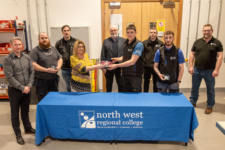 Josh Young, first in Electrical, receives his prize from Karen Moore, Head of Quality Enhancement at NWRC. Also included are staff at NWRC Springtown and Paull Rooney, third prize and Harry Rodgers, second prize.