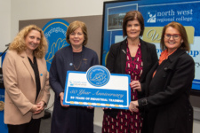 Four people pictured at the opening of springtown campus