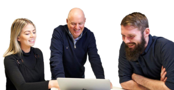 Group of three people smiling and looking at a laptop