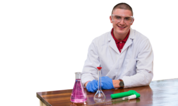 Student in lab coat with science equipment