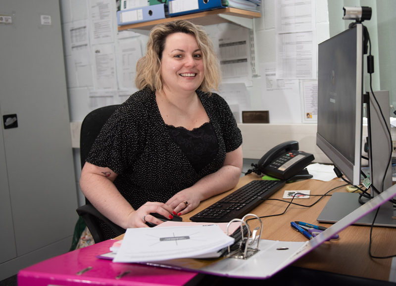 Admin student Mairead Fox sits in front of her office computer