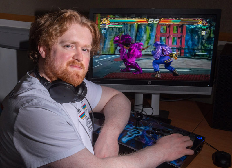 Esports student Aaron Wright uses joypad to play Tekken in the NWRC gaming lab 2