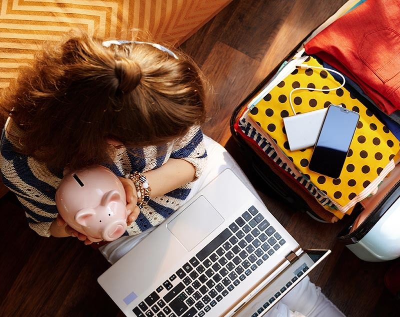 Student holding piggy bank