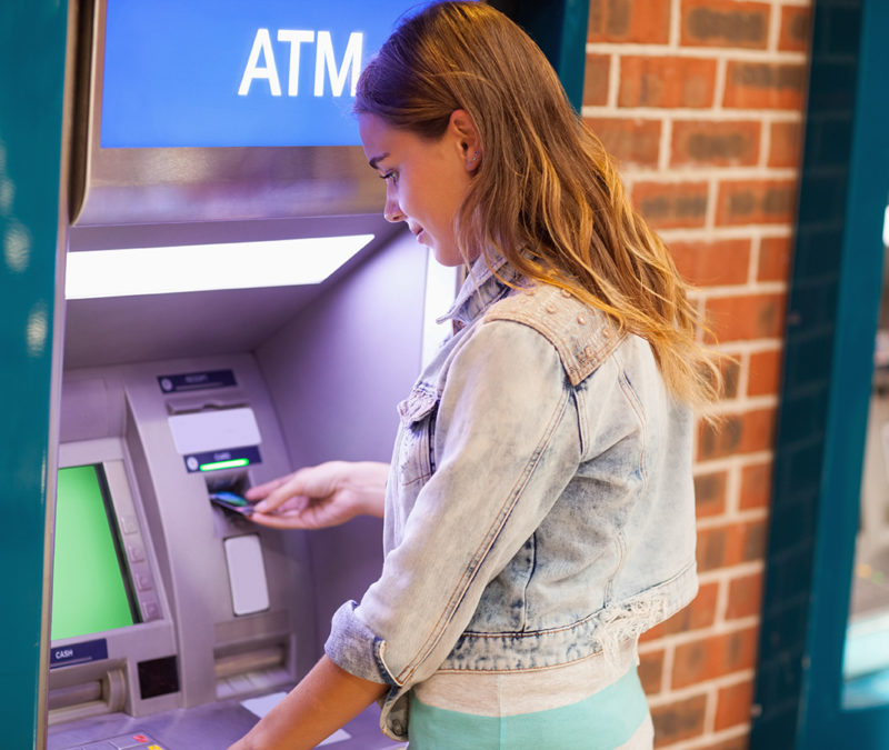 Female student using ATM