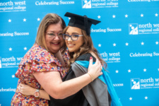 A mother hugs her daughter at NWRC graduation ceremony