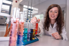 Female scientist in white lab coat