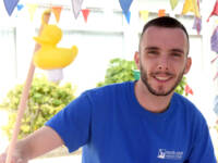 Male in blue tshirt with a rubber duck