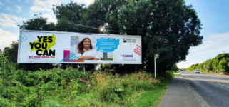 Outdoor billboard with 'yes you can'