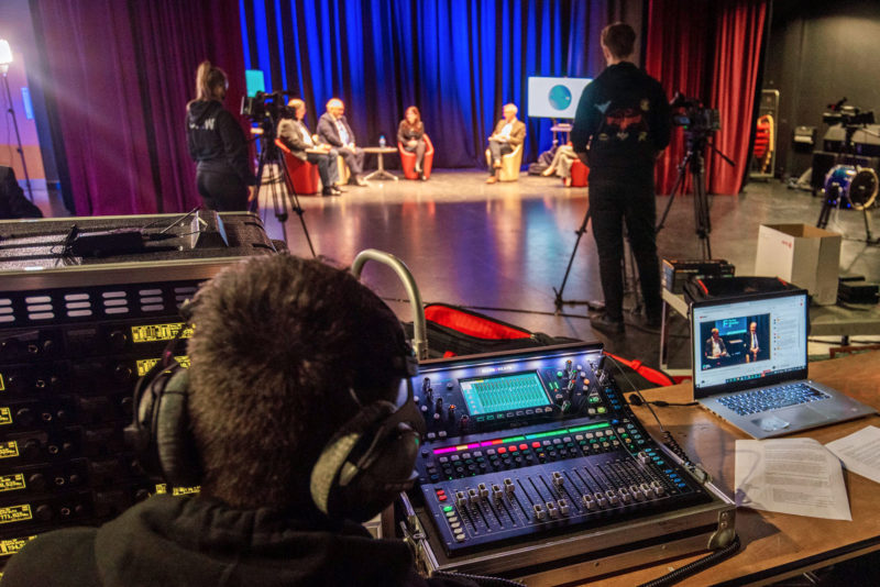 Adam and his classmates live stream a College event in the Foyle Theatre at Strand Road campus