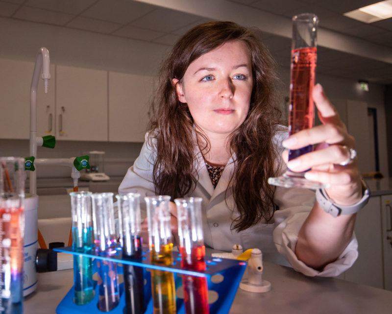 Holly Chemistry Teacher Graduate holds test tube with red liquid