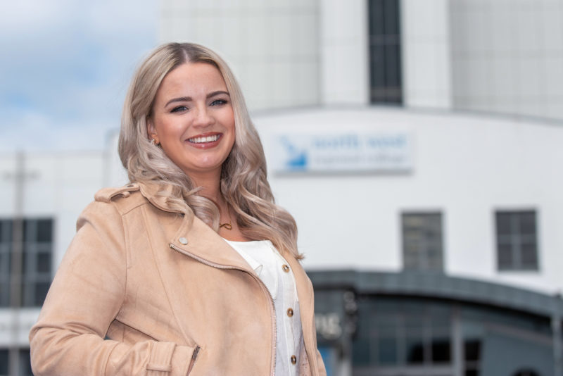 Bronagh Parke smiling outside the Tower Building at Strand Road campus