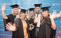 Group of graduates celebrate their graduation together