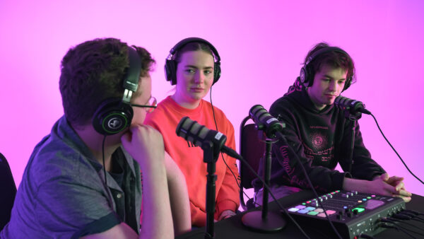 group of 3 media students during a college podcast