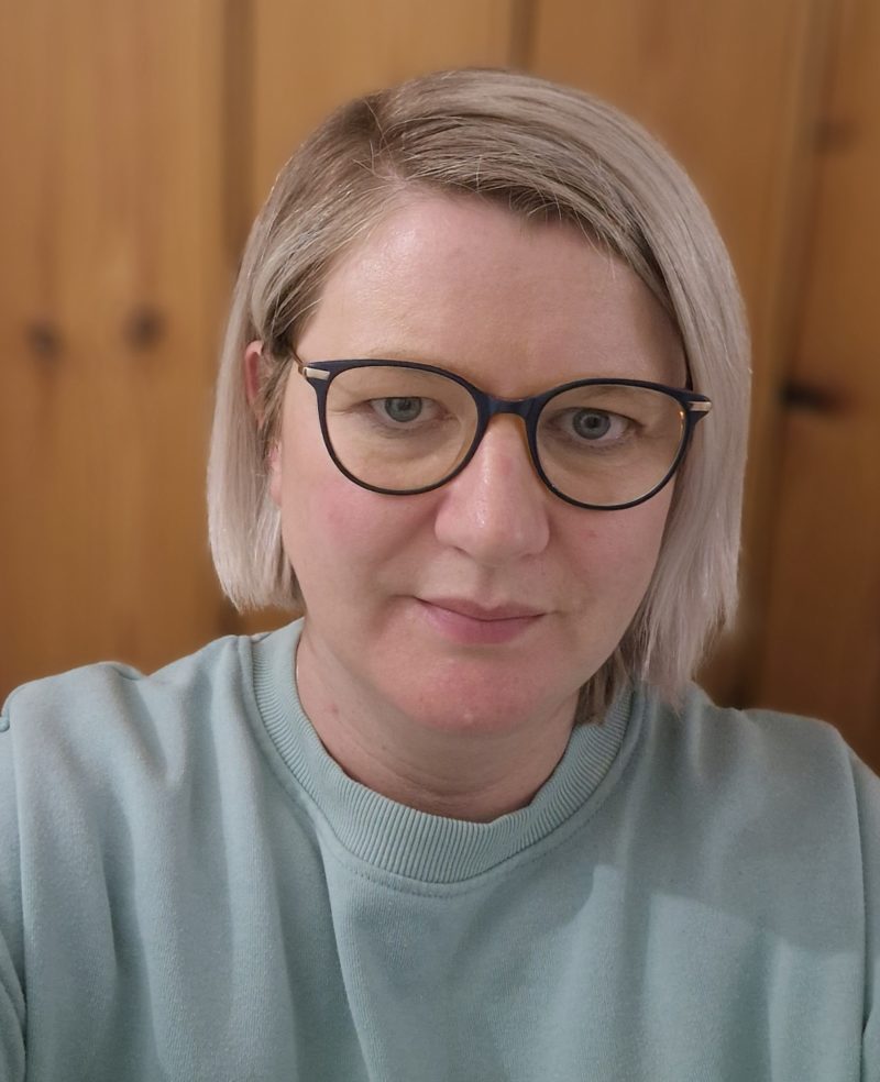 Picture of female lecturer at NWRC wearing glasses.