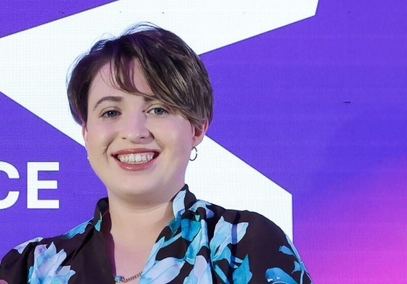 woman with short hair smiling