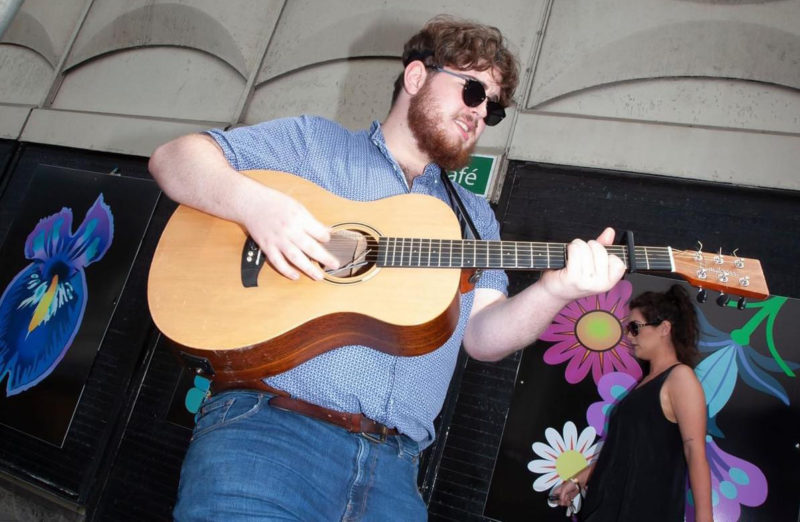 Joe Allan performing in the city