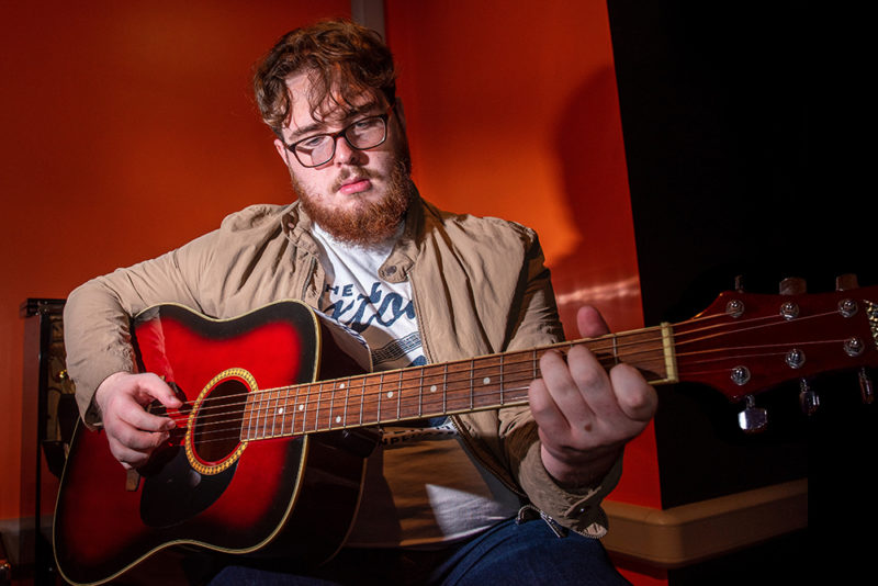 Joe Allan pictured with a guitar in the NWRC Recording Studios2