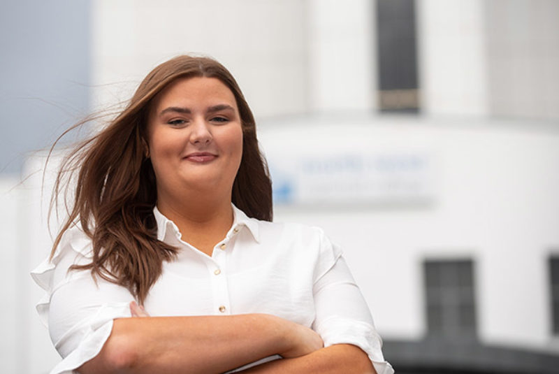 Katelyn McShane standing outside NWRC campus