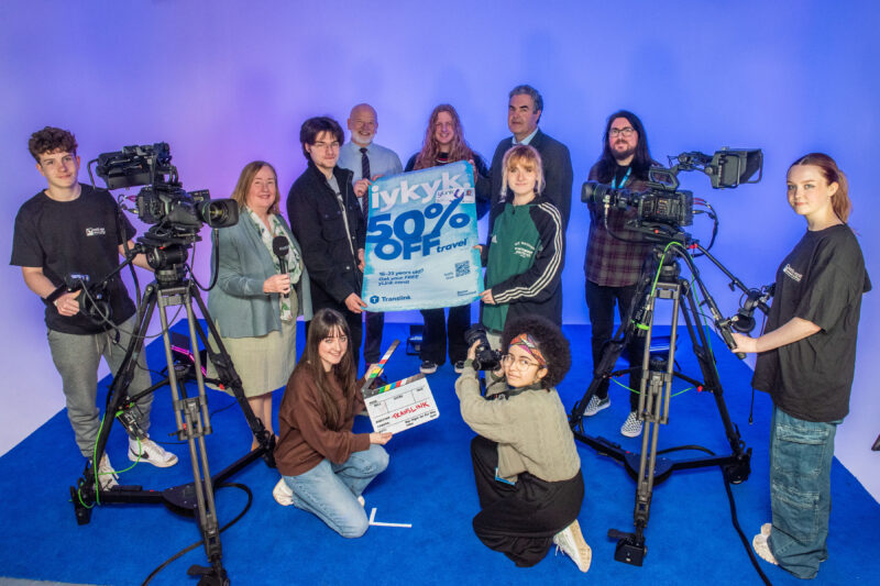 Group pictured in media suite of the college with camera equipment.