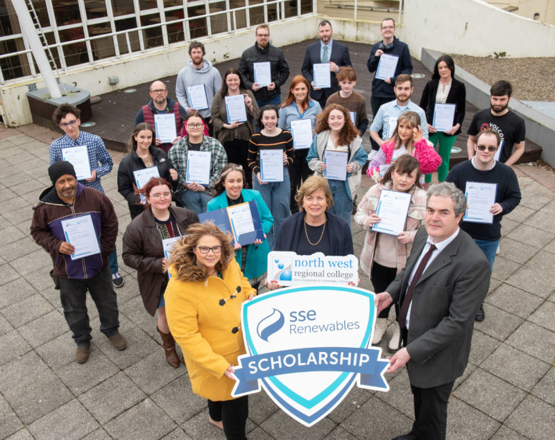 group of students pictured outside the college with SSE renewables shields, and each holding certificates.