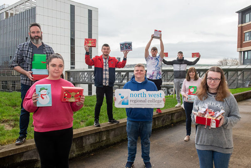 Group of NWRC students holding Christmas Eve boxes