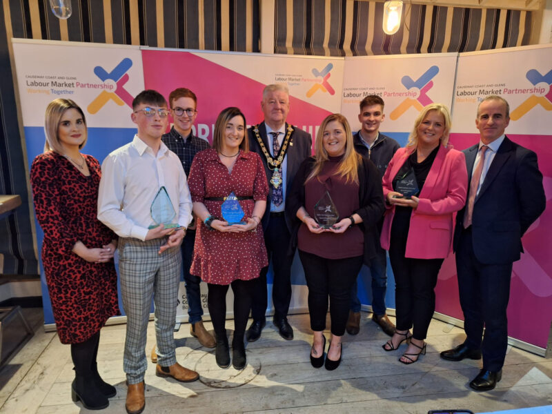 Group of people at awards ceremony.