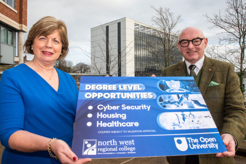 Two individuals pictured outside the college holding a photo prop highlighting the new courses offered at NWRC with the OU