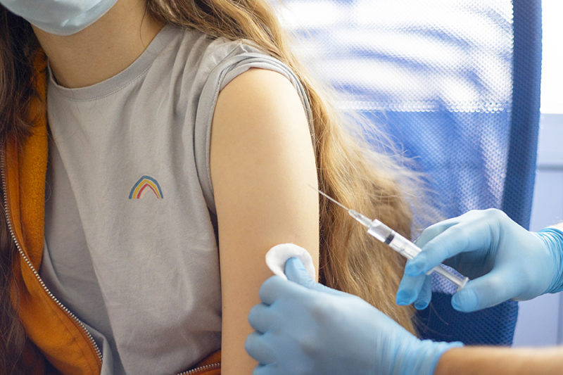 Teenage girl gets covid 19 vaccine