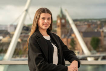Business woman standing at the footbridge