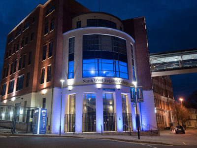College buildings illuminated in blue